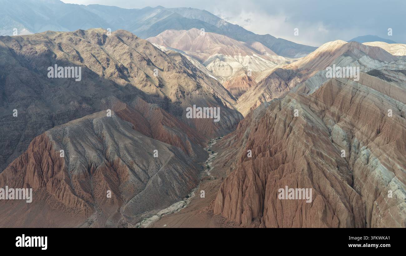 Aerial View Rocks Aerial view of the rugged mountainous landscape of Song-Kul with deep ...