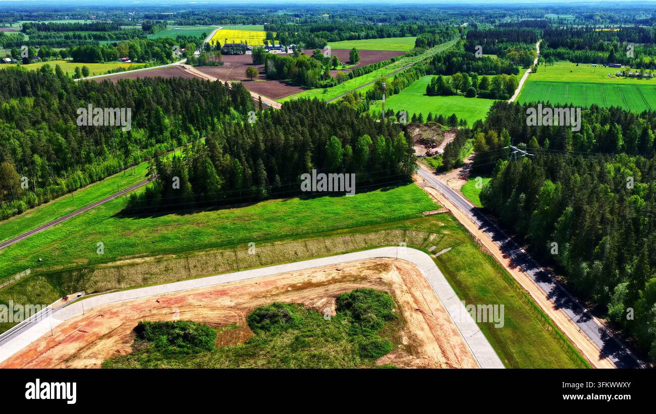 Aerial view of a rural landscape featuring dense forests, green ...