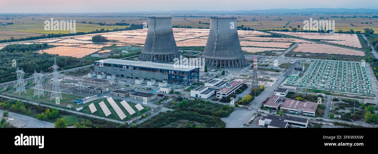 Aerial view of an industrial power complex featuring two large cooling ...
