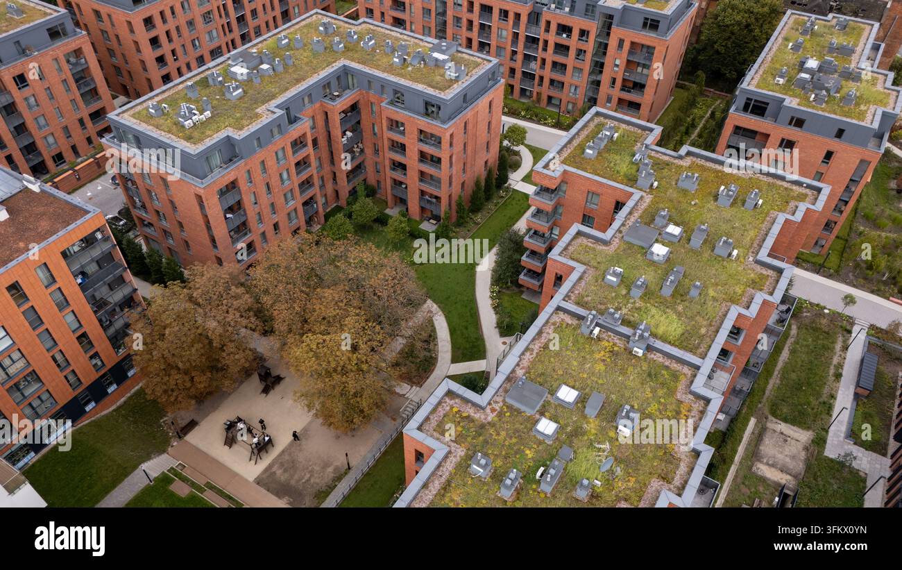 Aerial view of a modern residential complex featuring brick buildings ...