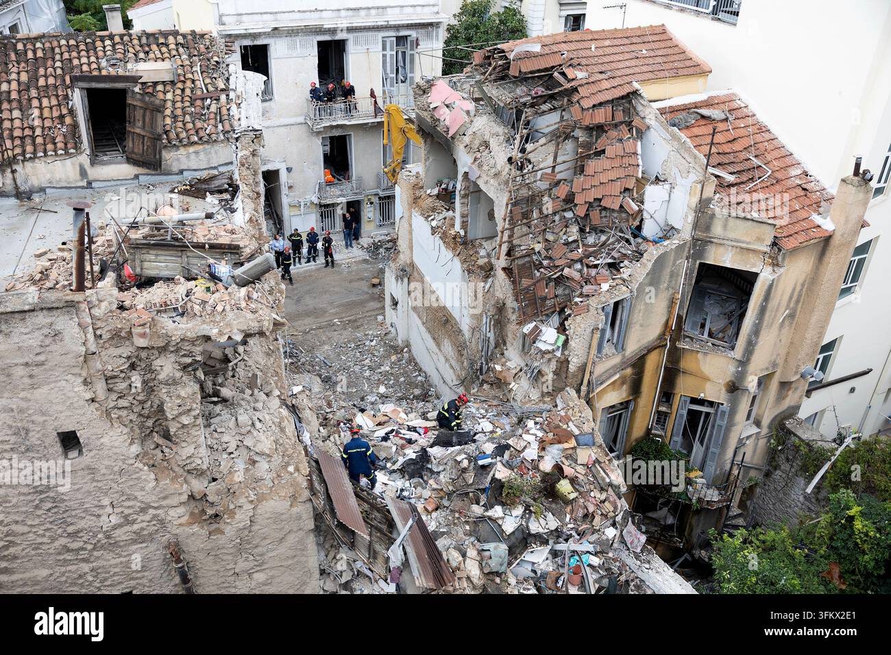 Firefighters work at the scene following Friday's powerful blast in ...