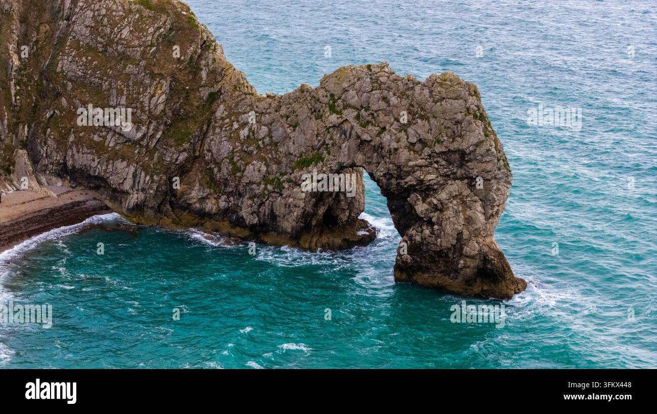 Aerial view of Durdle Door, a natural limestone arch on the Jurassic ...