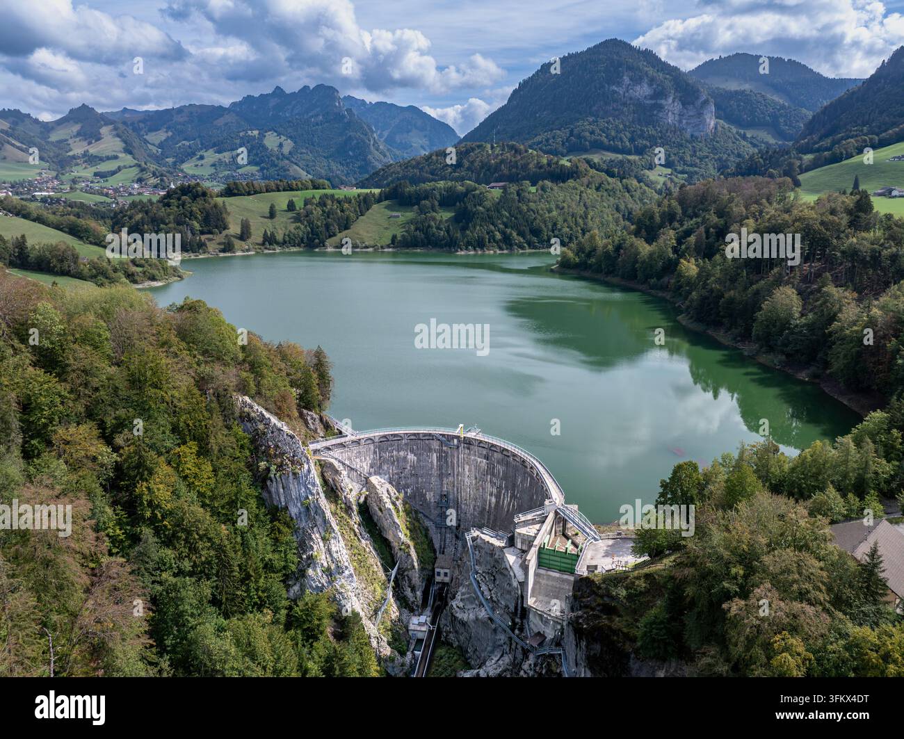 Aerial view of Barrage de Montsalvens, a concrete arch dam nestled in ...