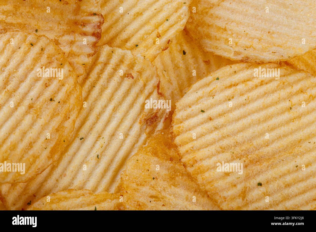 Lots of potato chips, texture close up Stock Photo
