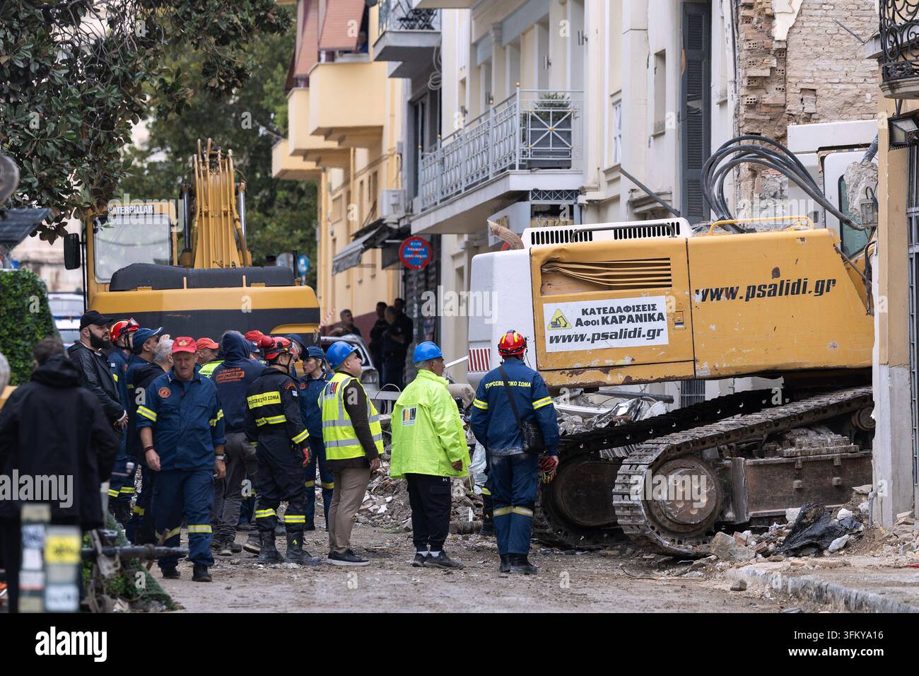 Rescuers work at the scene following Friday's powerful blast in Athens ...