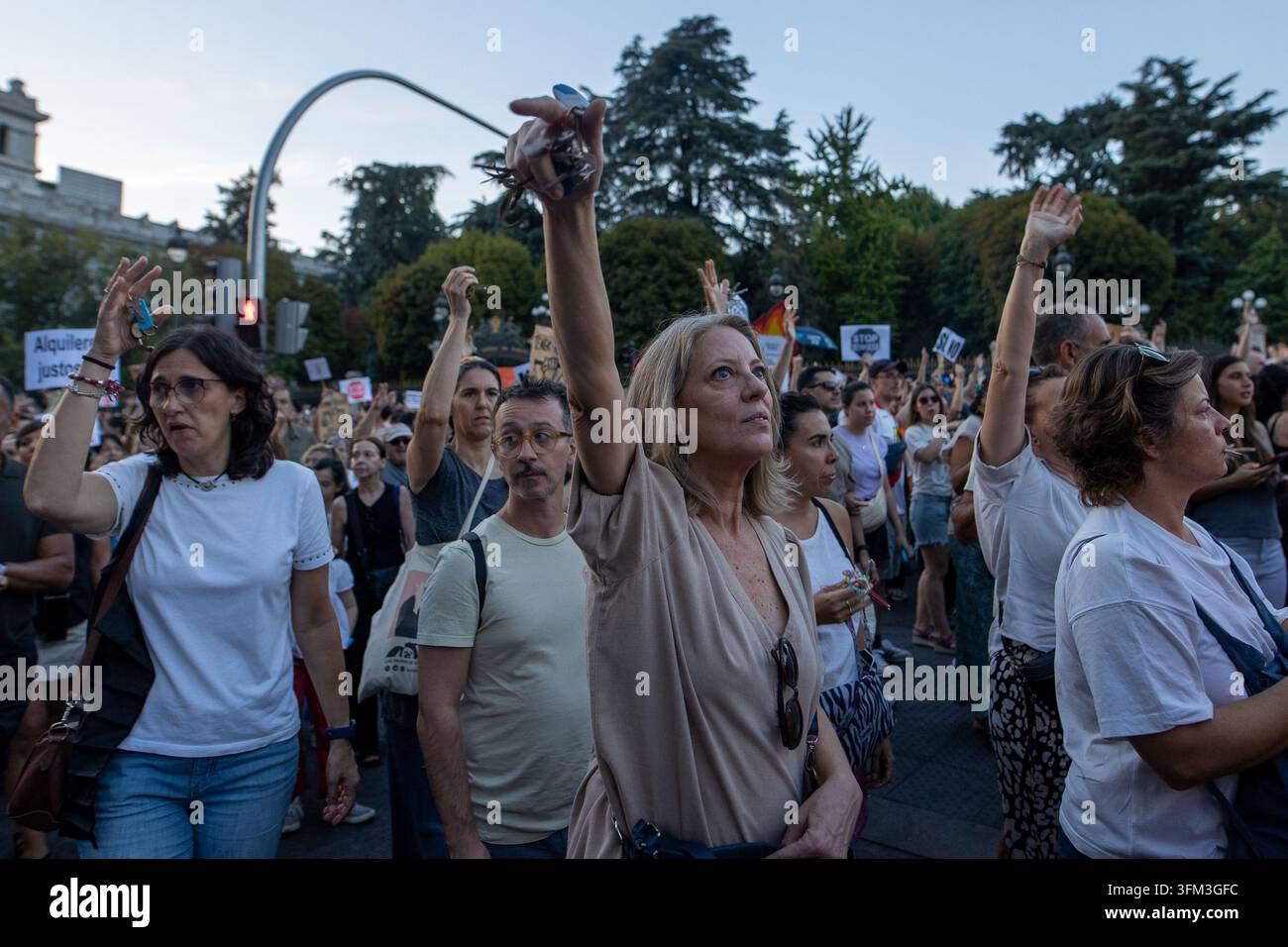 Protesters hold up keys during a housing protest in Madrid. Protest ...