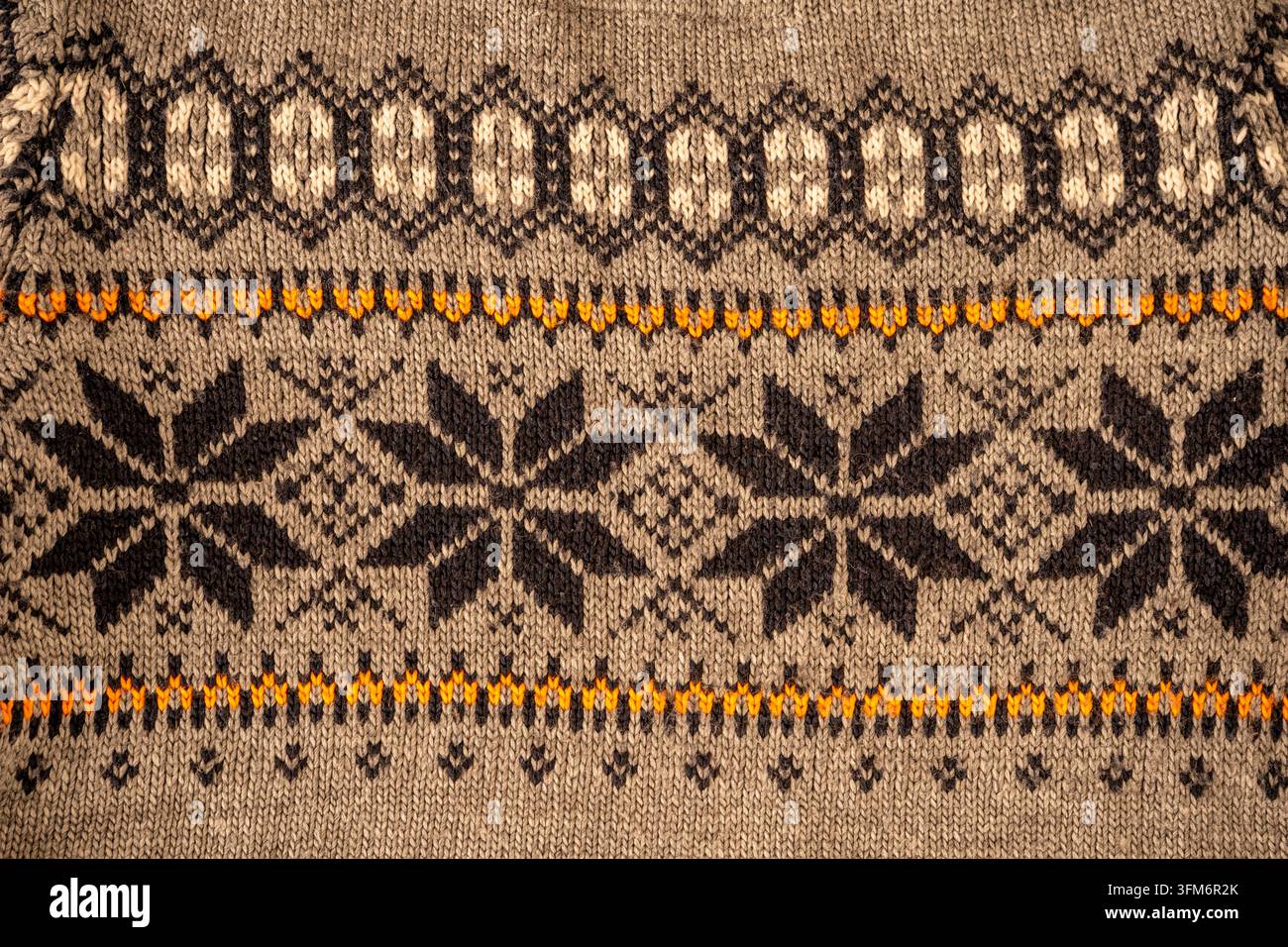 Nordic Knitted Pattern Background. Texture Christmas sweater. Stock Photo