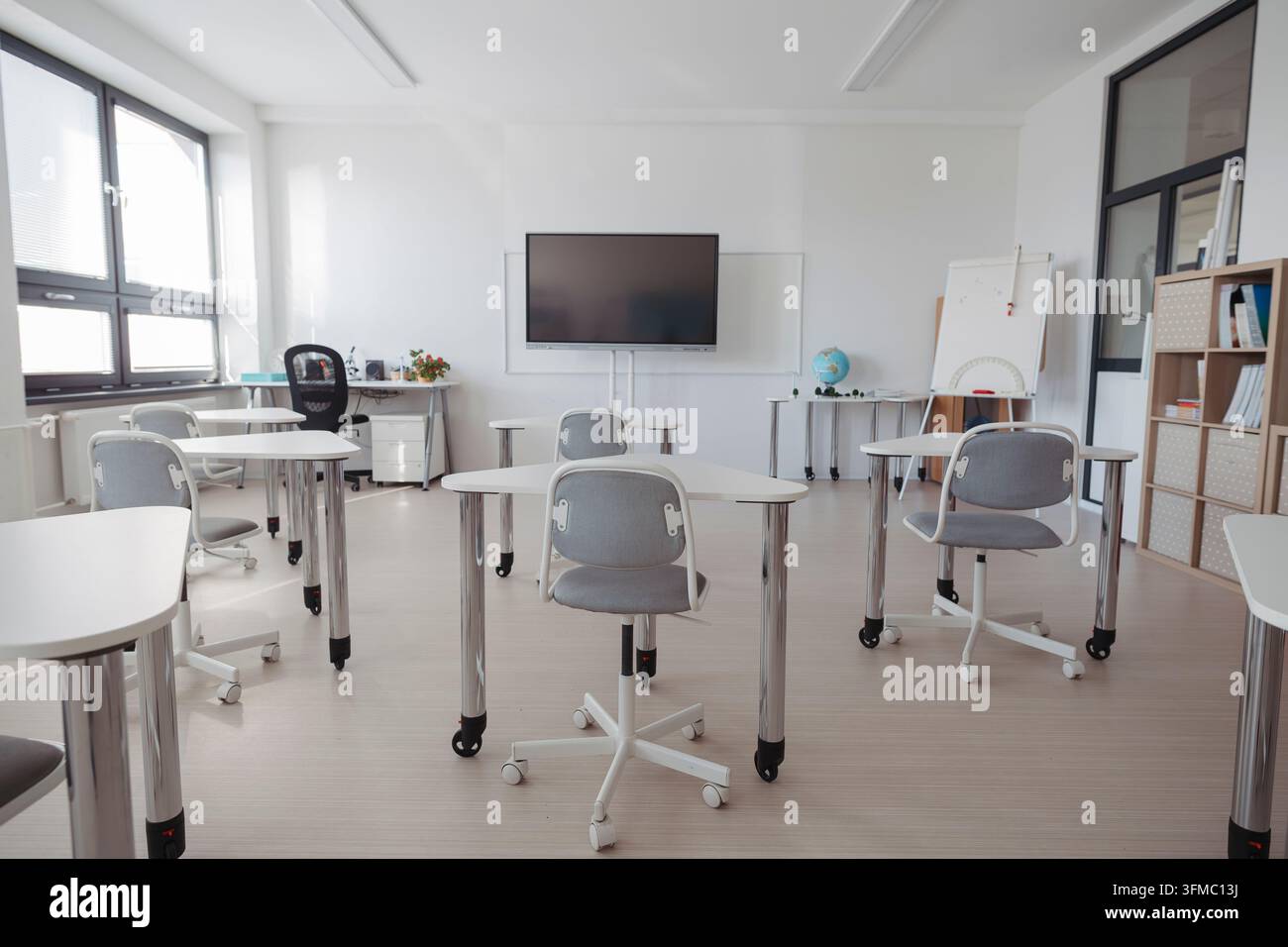 Empty modern primary school classroom ready for students. Stock Photo