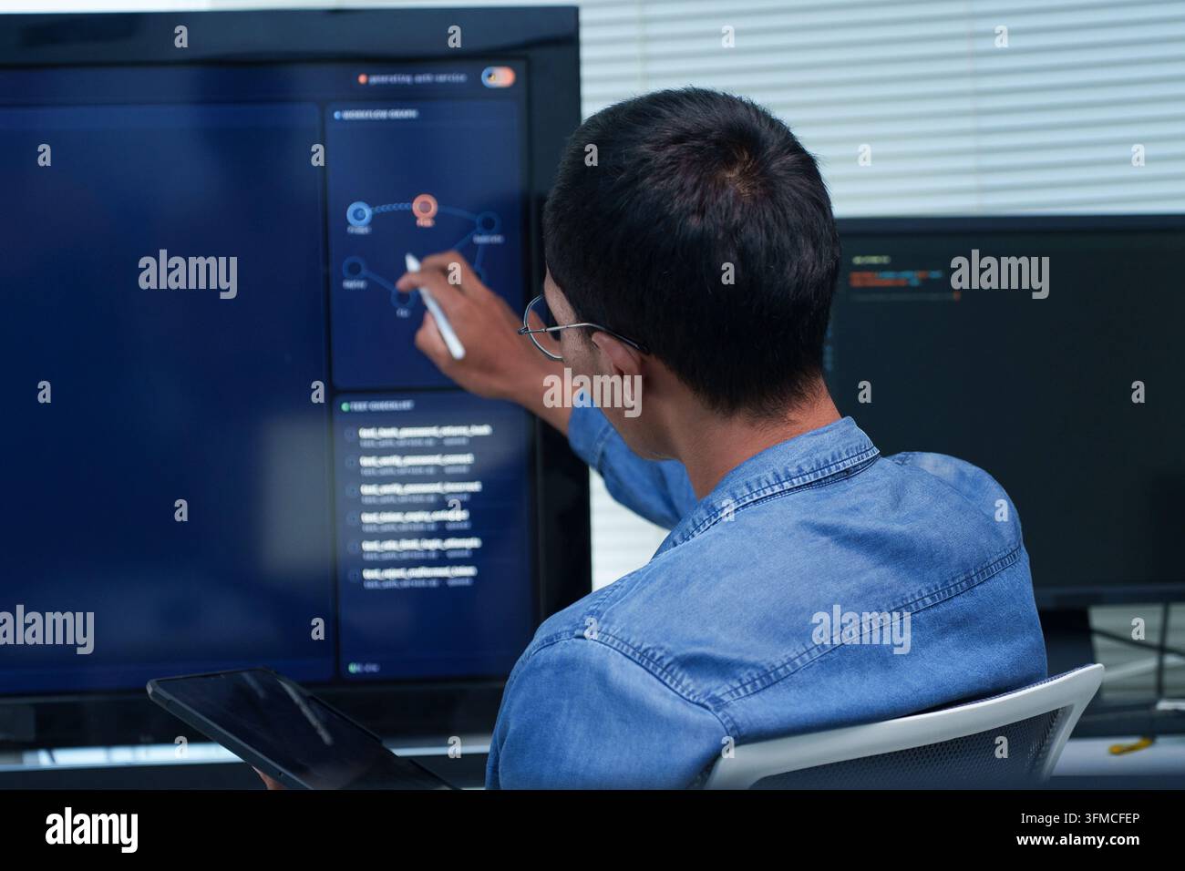 Programmer Developing Artificial Intelligence Software Stock Photo