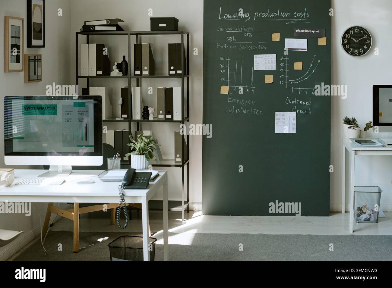 Modern Empty Office Workspace Showing SWOT Analysis on Computer Screen Stock Photo