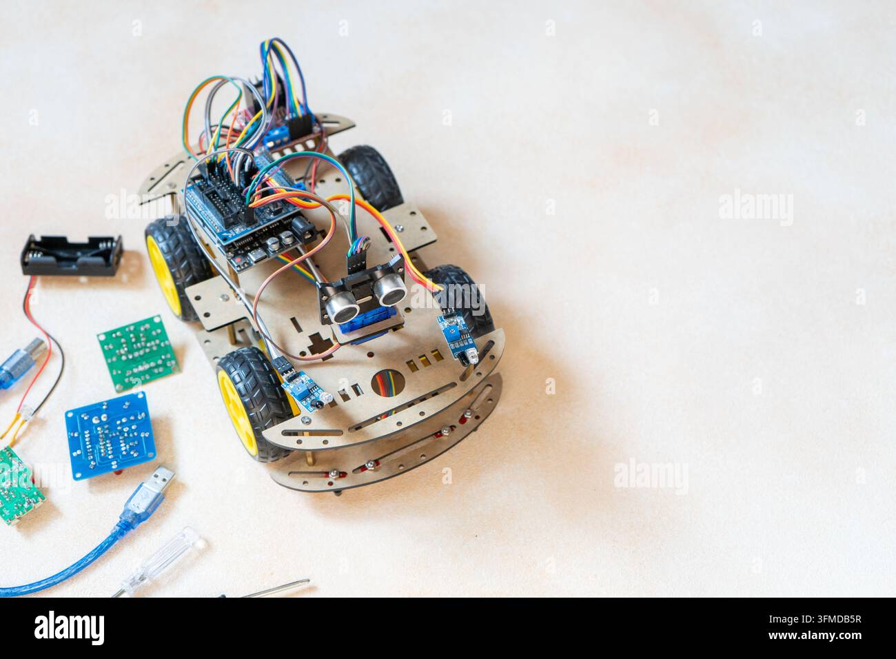DIY Robot Car Assembly and Components. Educational electronics project for STEM learning and robotics copy space. Stock Photo