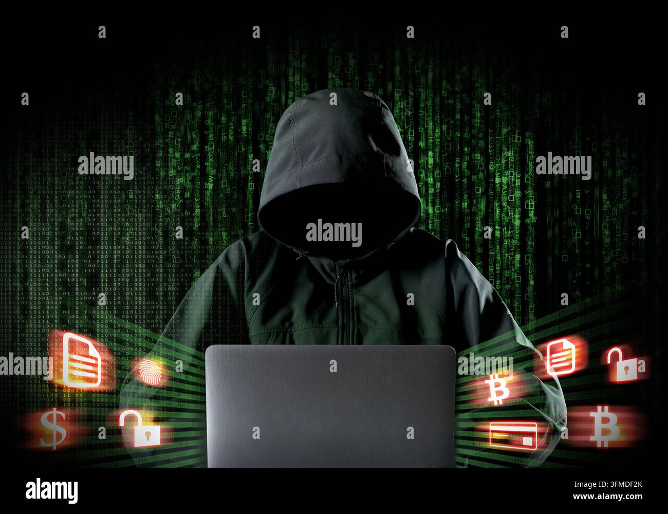 Anonymous hooded hacker using laptop with digital code and cryptocurrency security icons Stock Photo