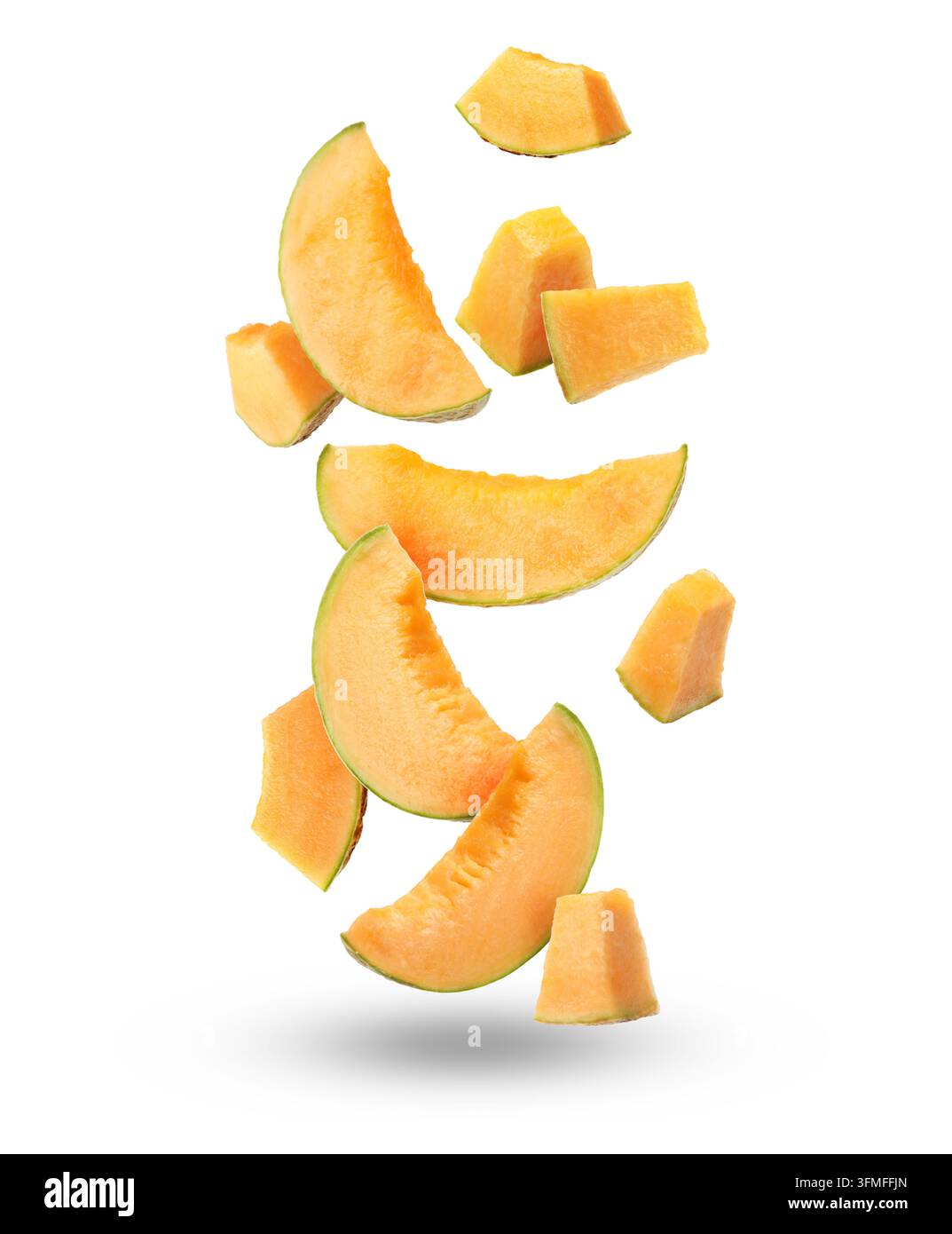 Pieces of cantaloupe melon falling on white background Stock Photo