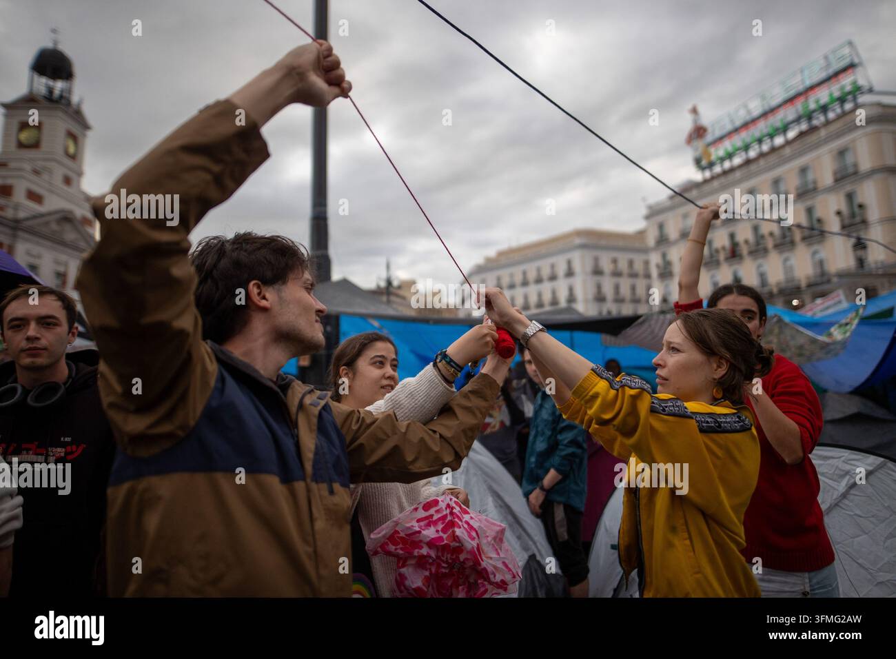 Design Ropes Icon Pro-housing activists tie ropes during the housing encampment in Madrid ...