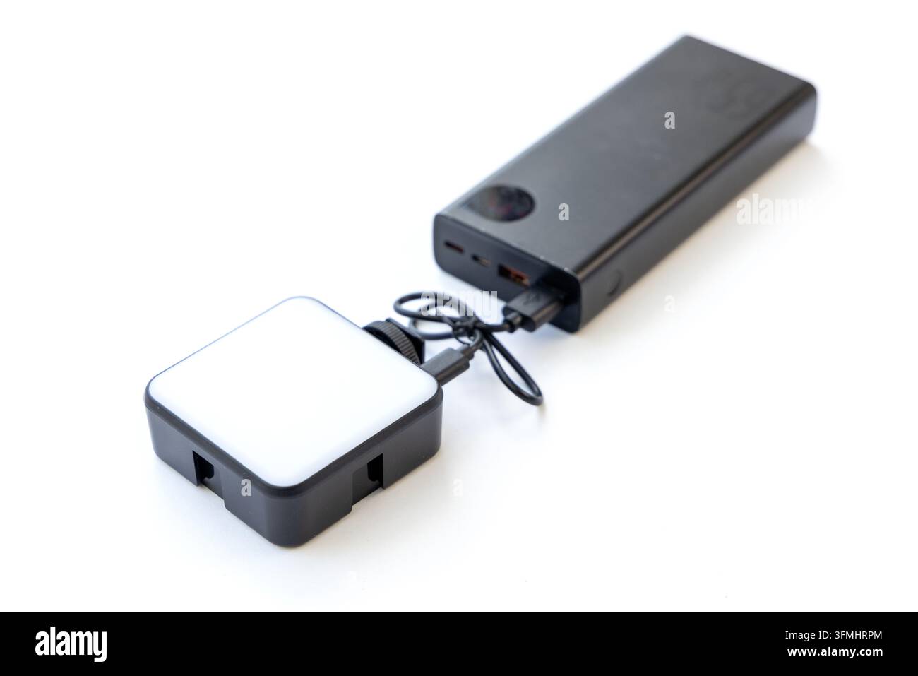 Led Light Programs Black LED light panel charging from a portable power bank Stock Photo ...