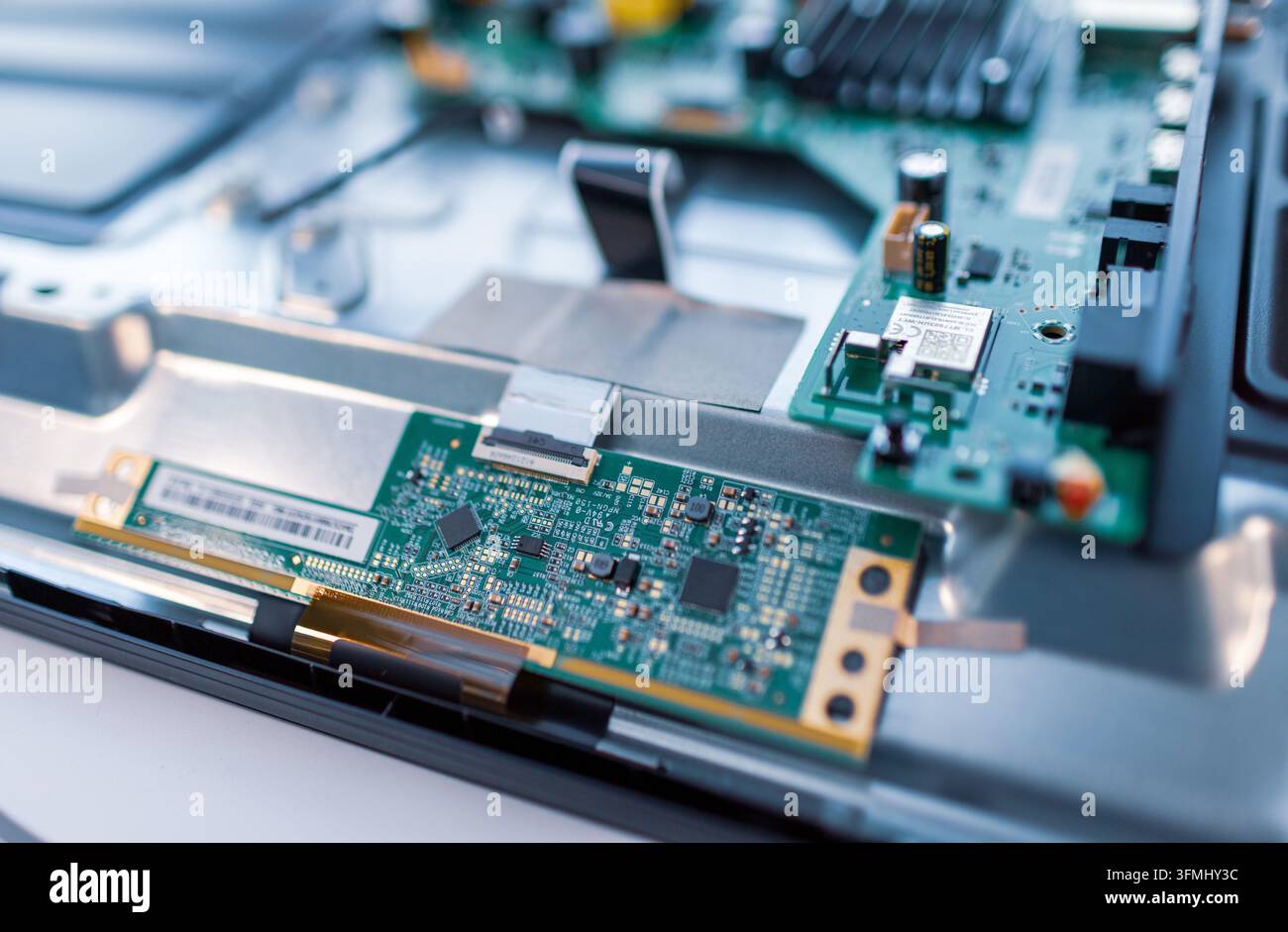 Electronic components are mounted on a green printed circuit board ...