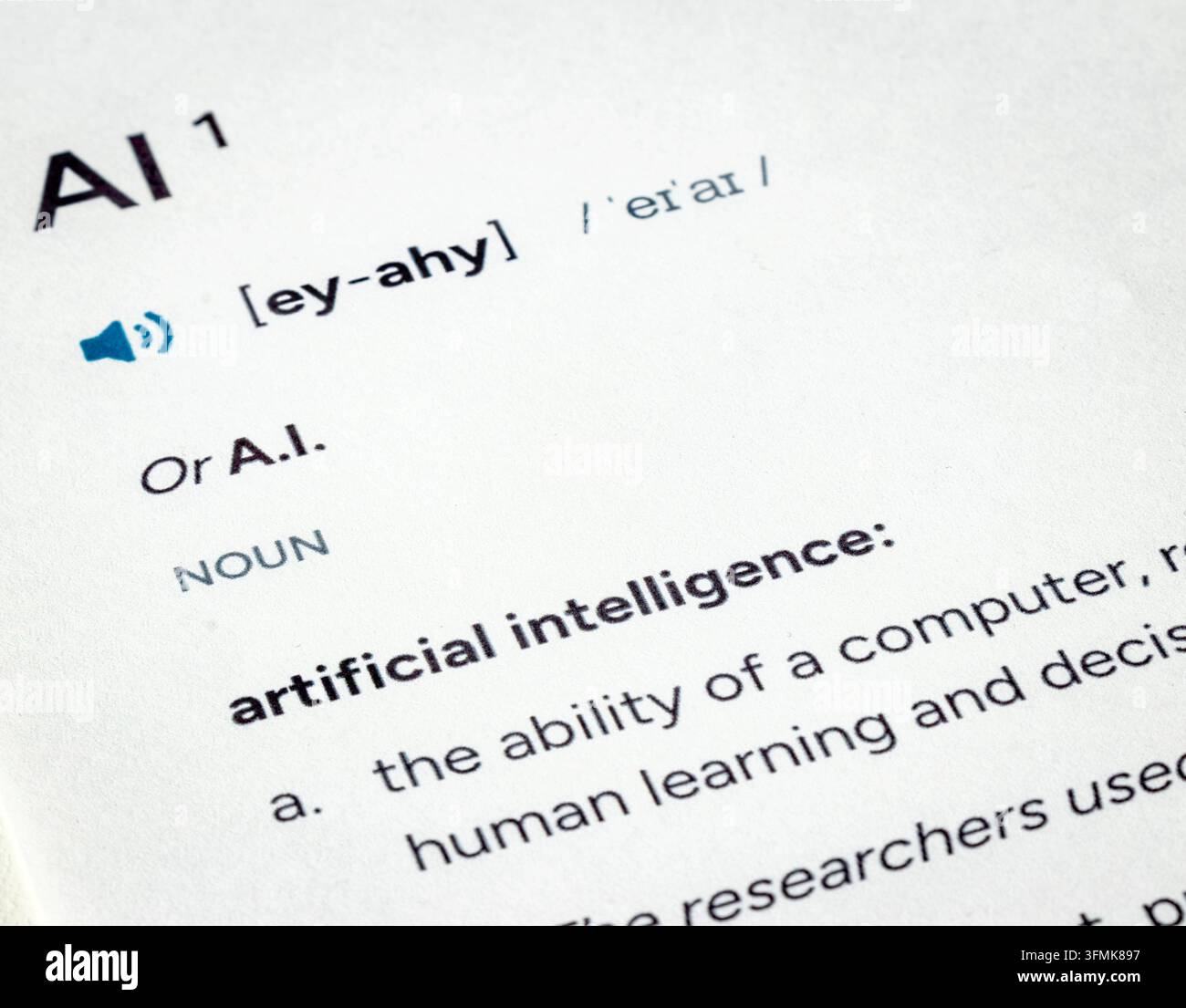 Dictionary entry and definition for term AI on paper Stock Photo