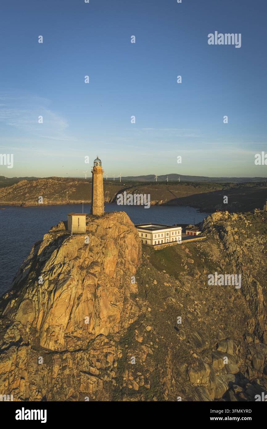 Aerial view of the lighthouse perched on a rocky cliff overlooking the ...