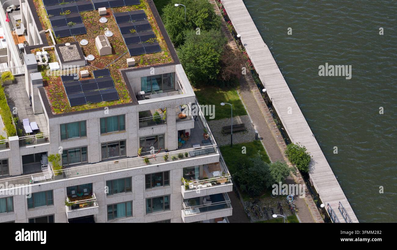 Aerial view of a modern residential building with a green roof and ...