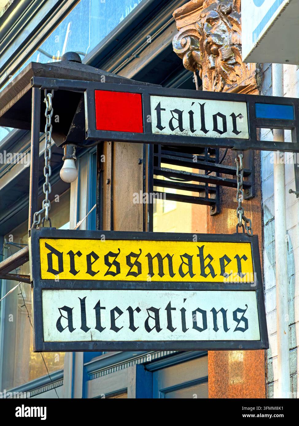 Traditional tailor, dressmaker and alterations sign on Mare Street in Hackney, east London. Stock Photo
