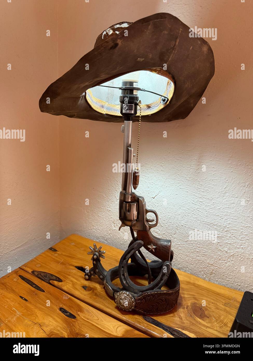 Bandera, Texas, USA. 14th September, 2026. Cowboy lamp with hat, gun ...