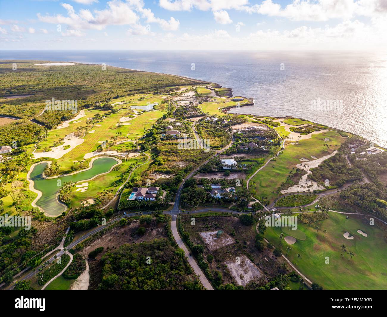 Aerial view of Corales Golf Course, featuring green fairways, sand ...