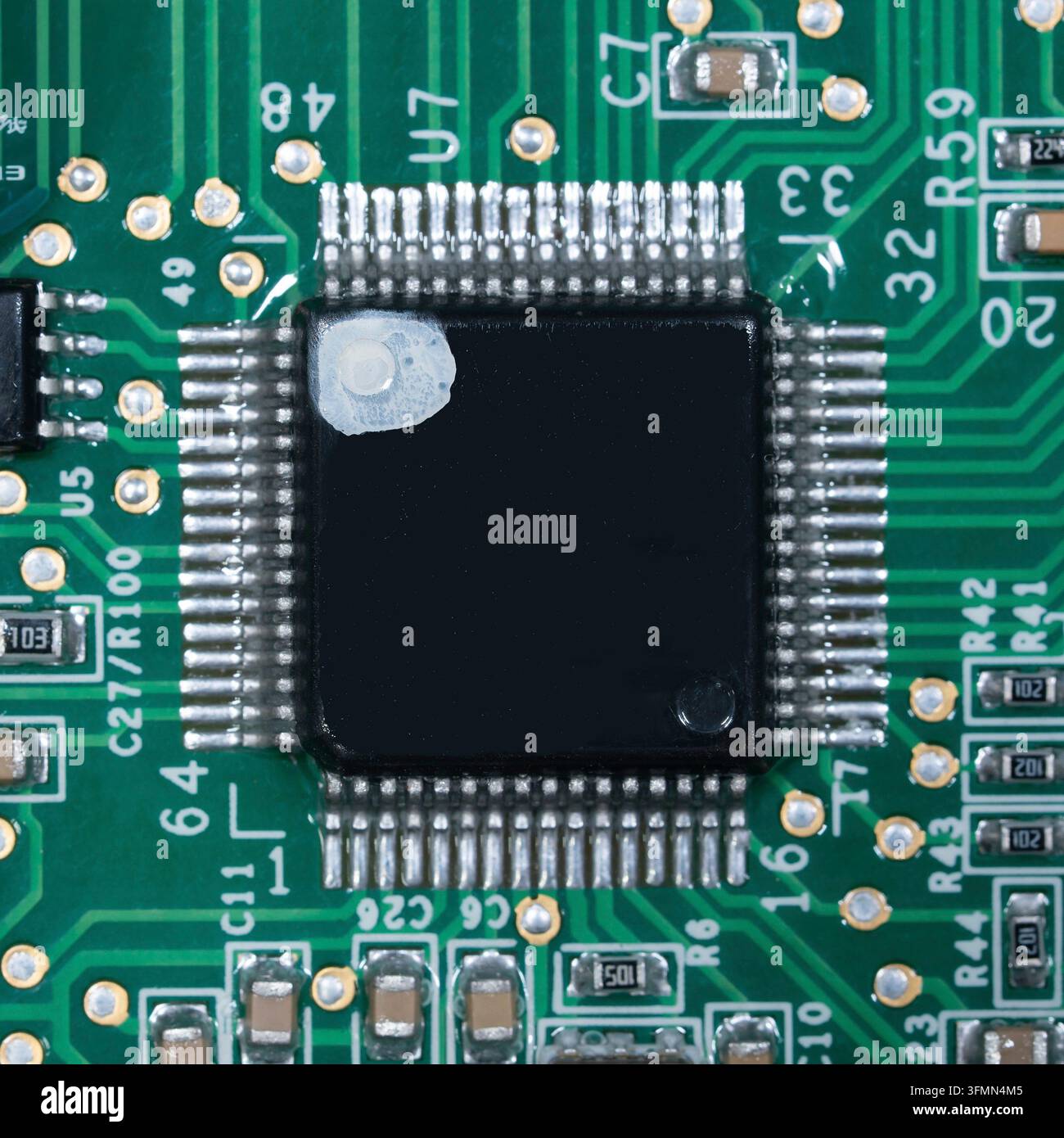 Macro of small microprocessor soldered printed circuit board Stock Photo