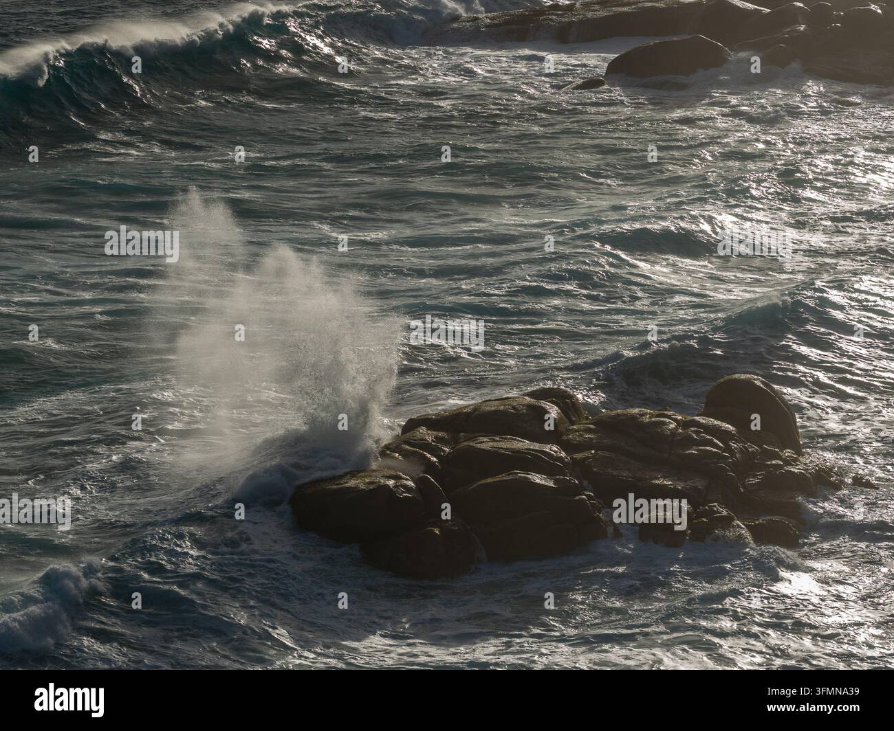 Aerial View Rocks Aerial view of powerful ocean waves crashing against dark coastal rocks ...