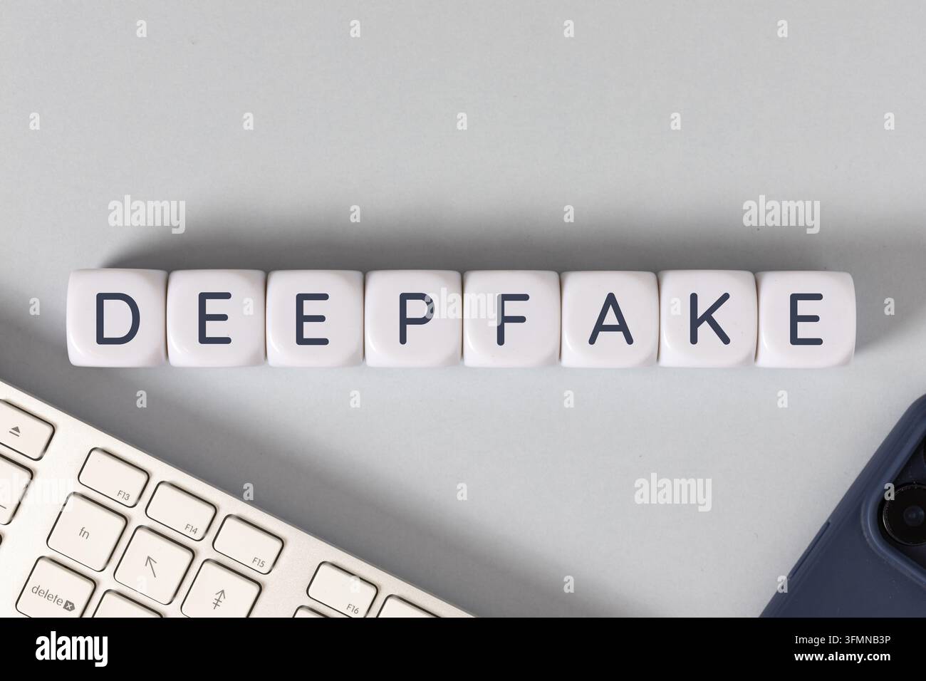 deepfake text on white cubes. flat lay Stock Photo