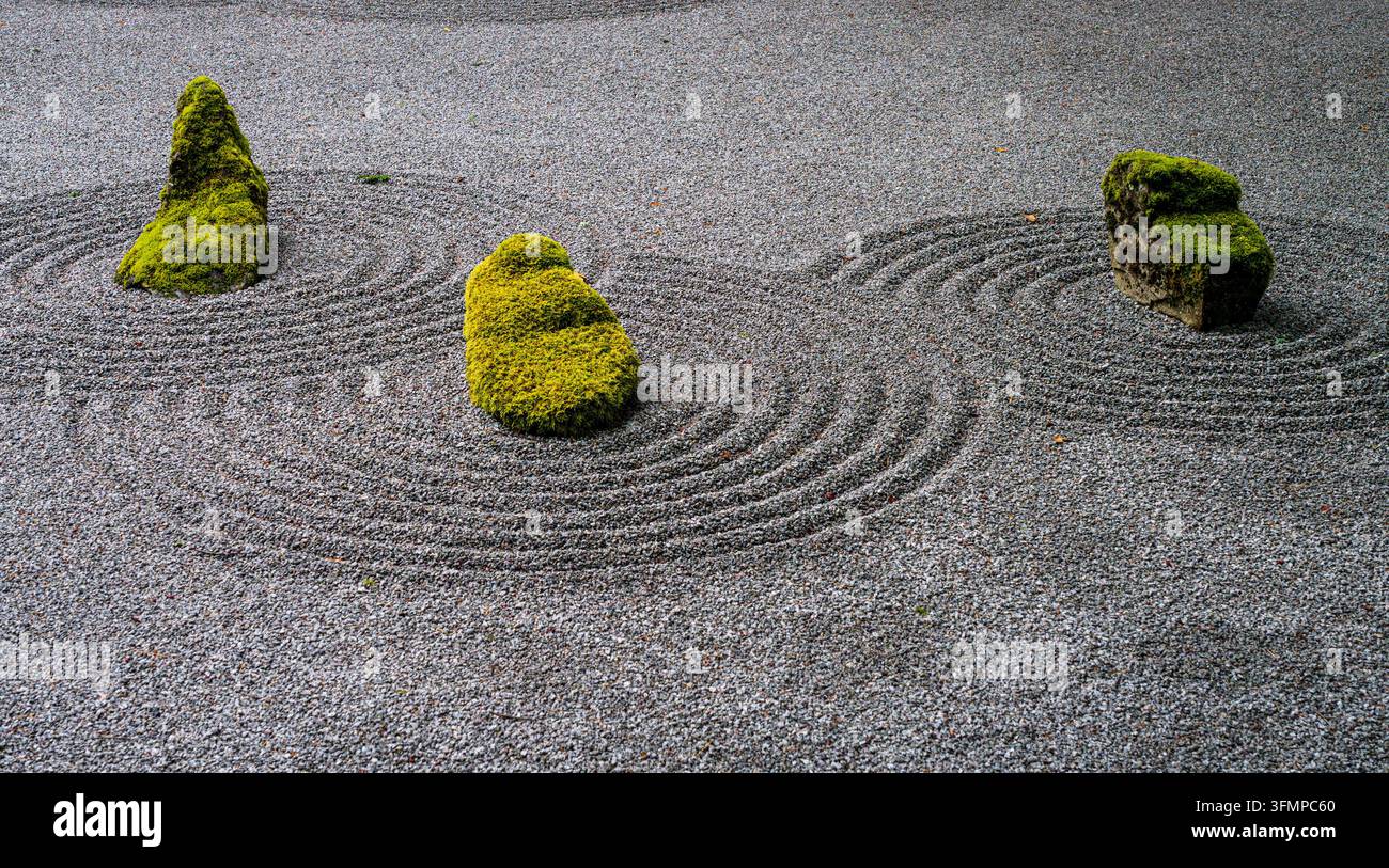 zen-rock-garden-featuring-moss-covered-stones-and-raked-gravel-enclosed