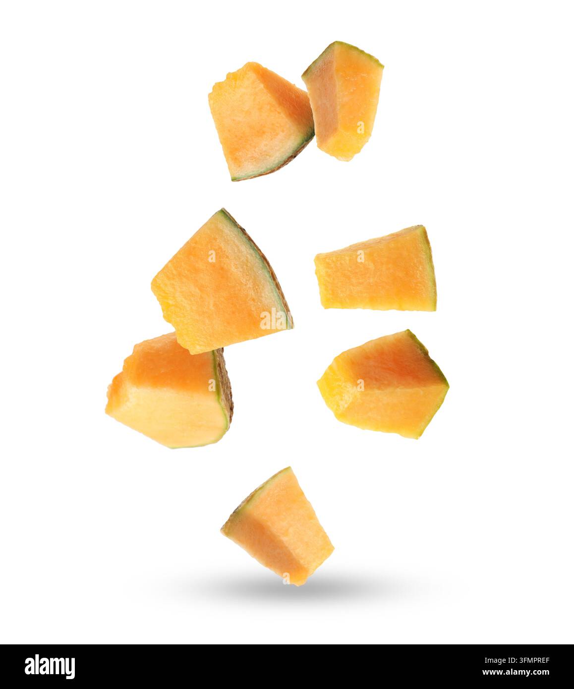 Pieces of cantaloupe melon falling on white background Stock Photo