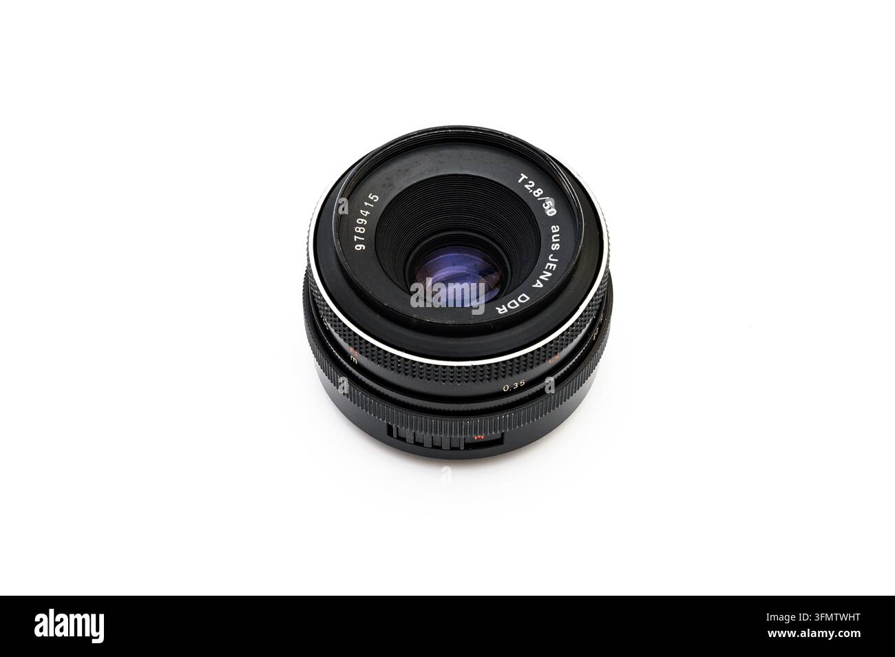 Iserlohn, Germany - September 20, 2026: Vintage aus Jena DDR T 2.8 50mm manual camera lens isolated on white background. Stock Photo