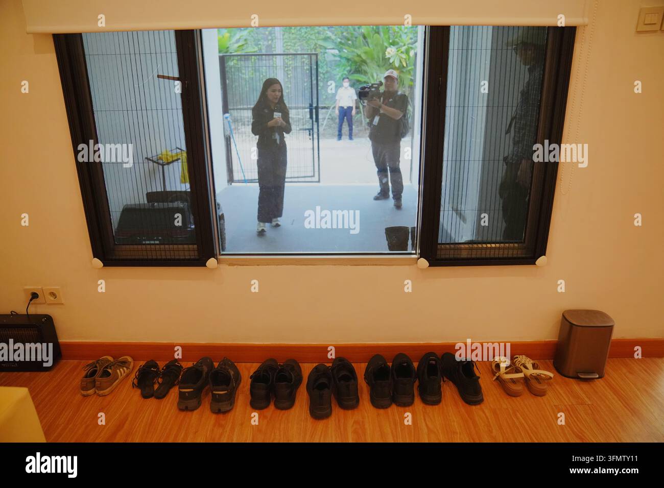 Rows of shoes are seen at a controversial luxury compound inside a ...