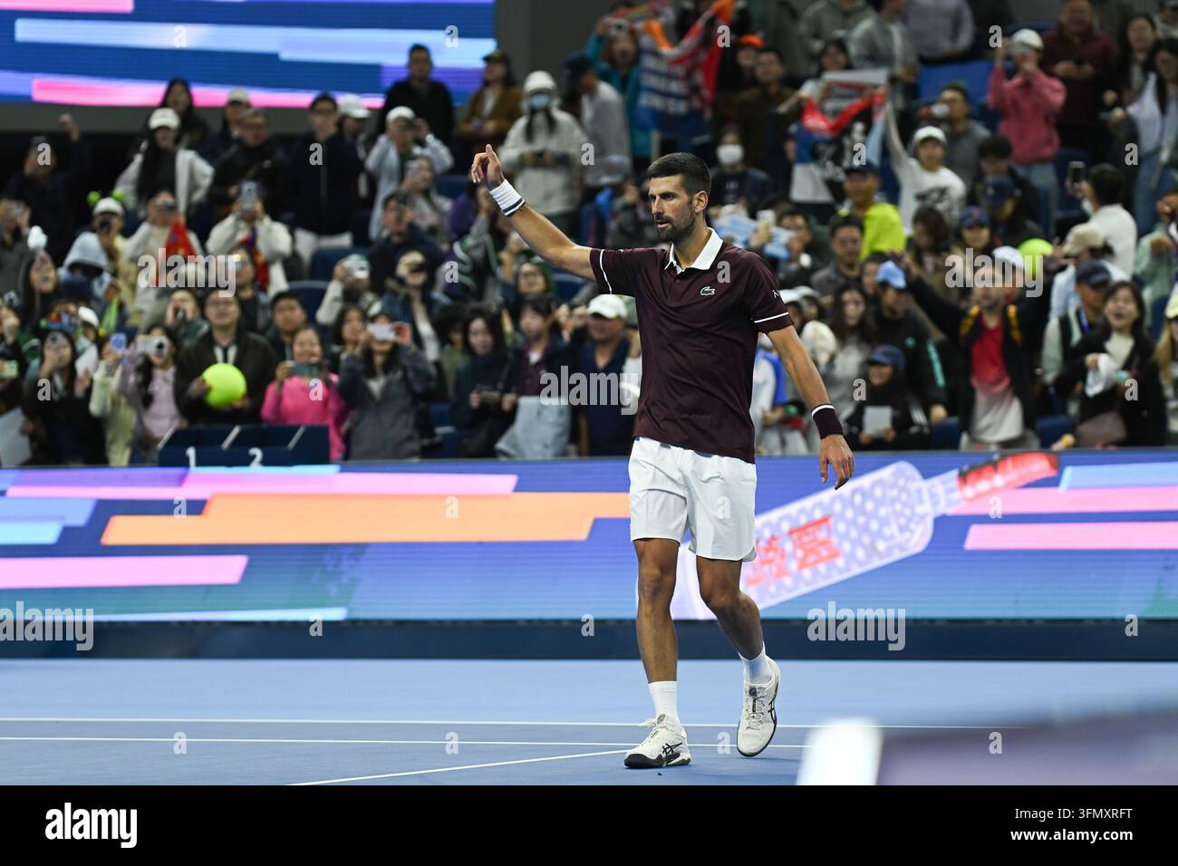 Novak Djokovic Hit in Face by Thrown Cap During Autograph Session at China Open Novak Djokovic Hit in Face by Thrown Cap During Autograph Session at China Open