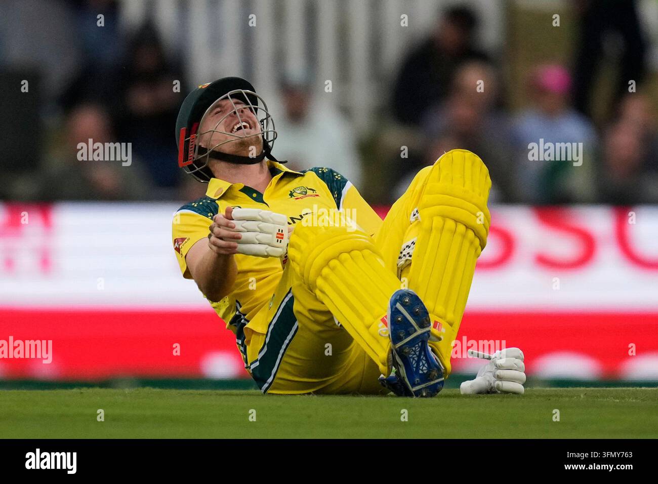 Australia's Cameron Green reacts after being hit by a ball during the