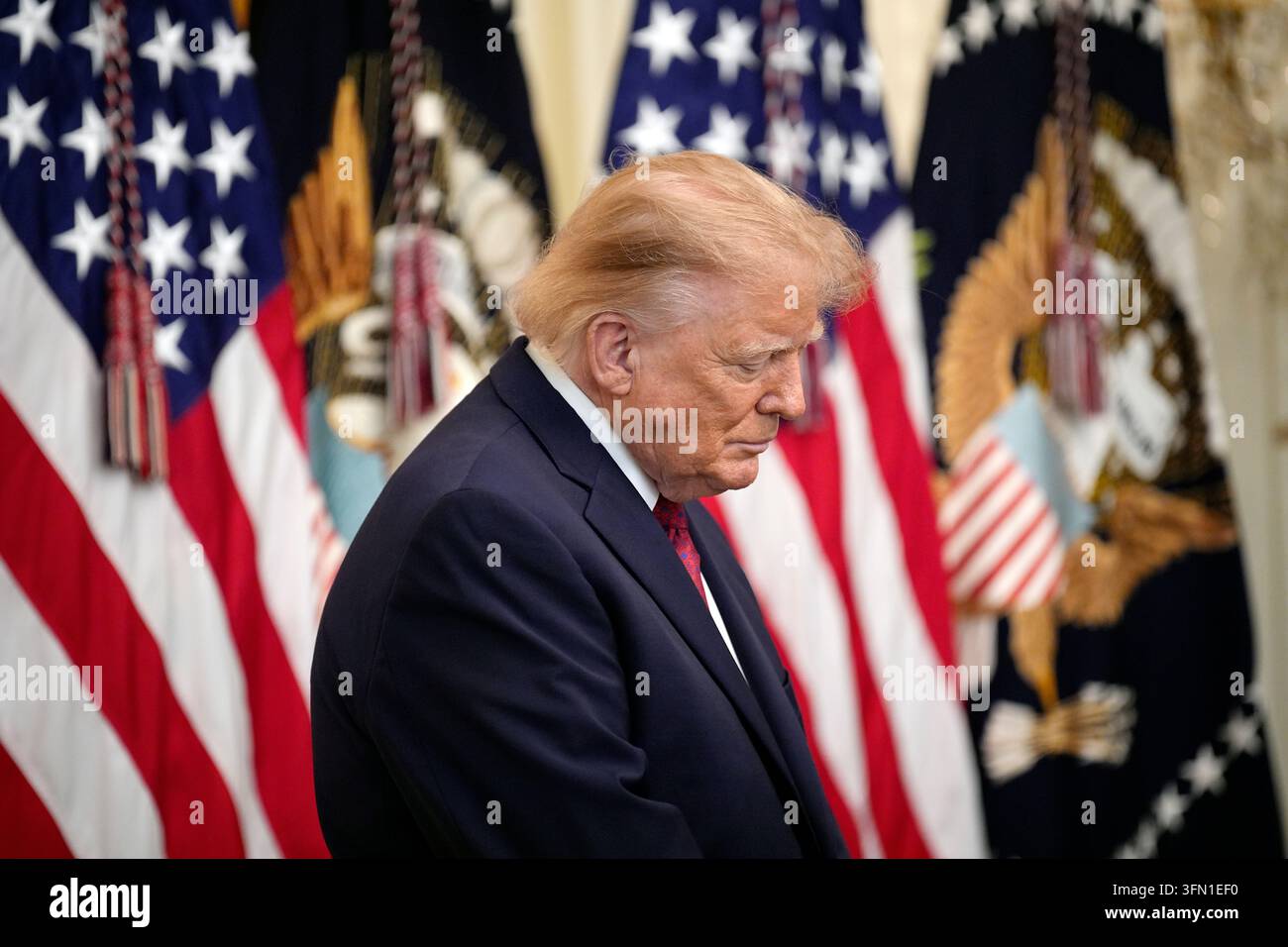 United States President Donald J Trump prays during the Hispanic ...