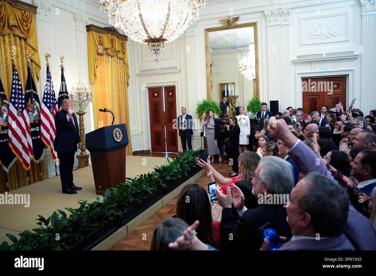 United States President Donald J Trump waves to the crowd after ...