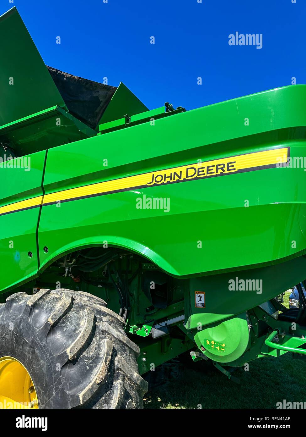 John Deere Combine Harvester Side View. Osceola, IN USA - September 26, 2026 - Smartphone Captured Stock Image