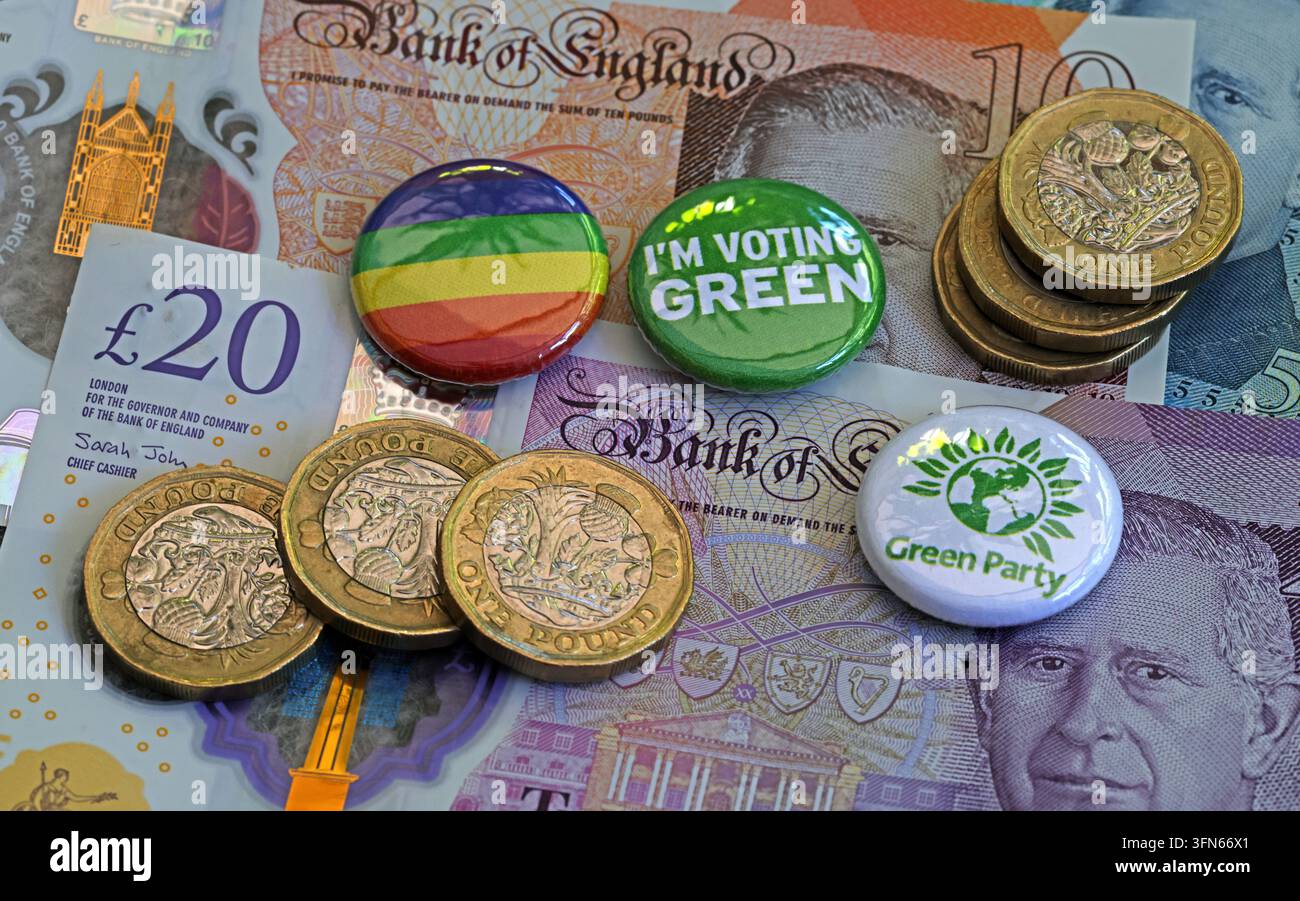 Green Party badges, rainbow badge and sterling banknotes illustrating UK political funding and campaigning. Stock Photo