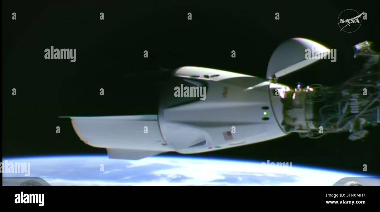 This image taken from video by NASA shows a SpaceX capsule carrying ...