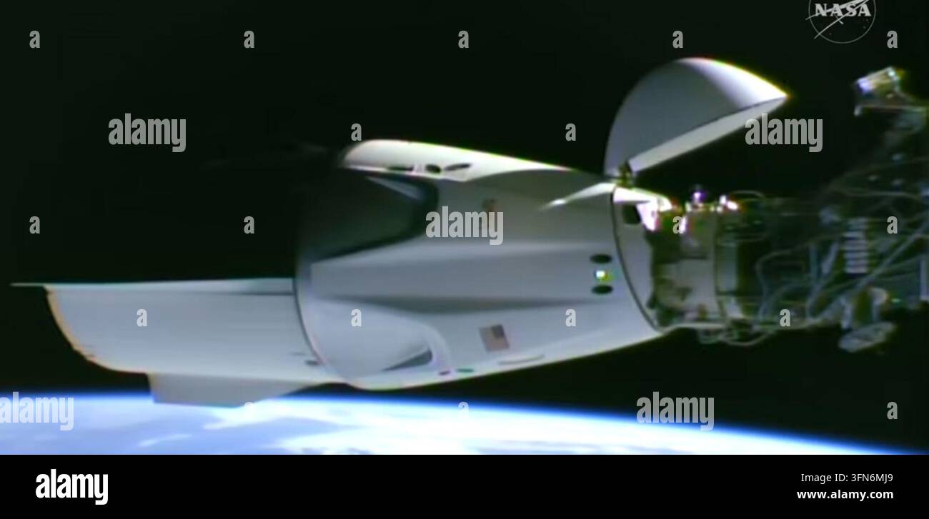 This image taken from video by NASA shows a SpaceX capsule carrying ...