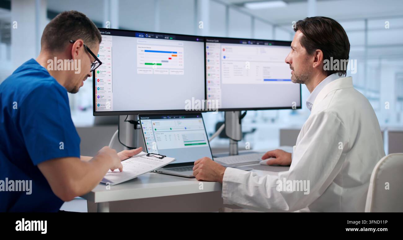 Healthcare Manager Carefully Reviews Medical Billing Claims On Laptop Screen. Stock Photo