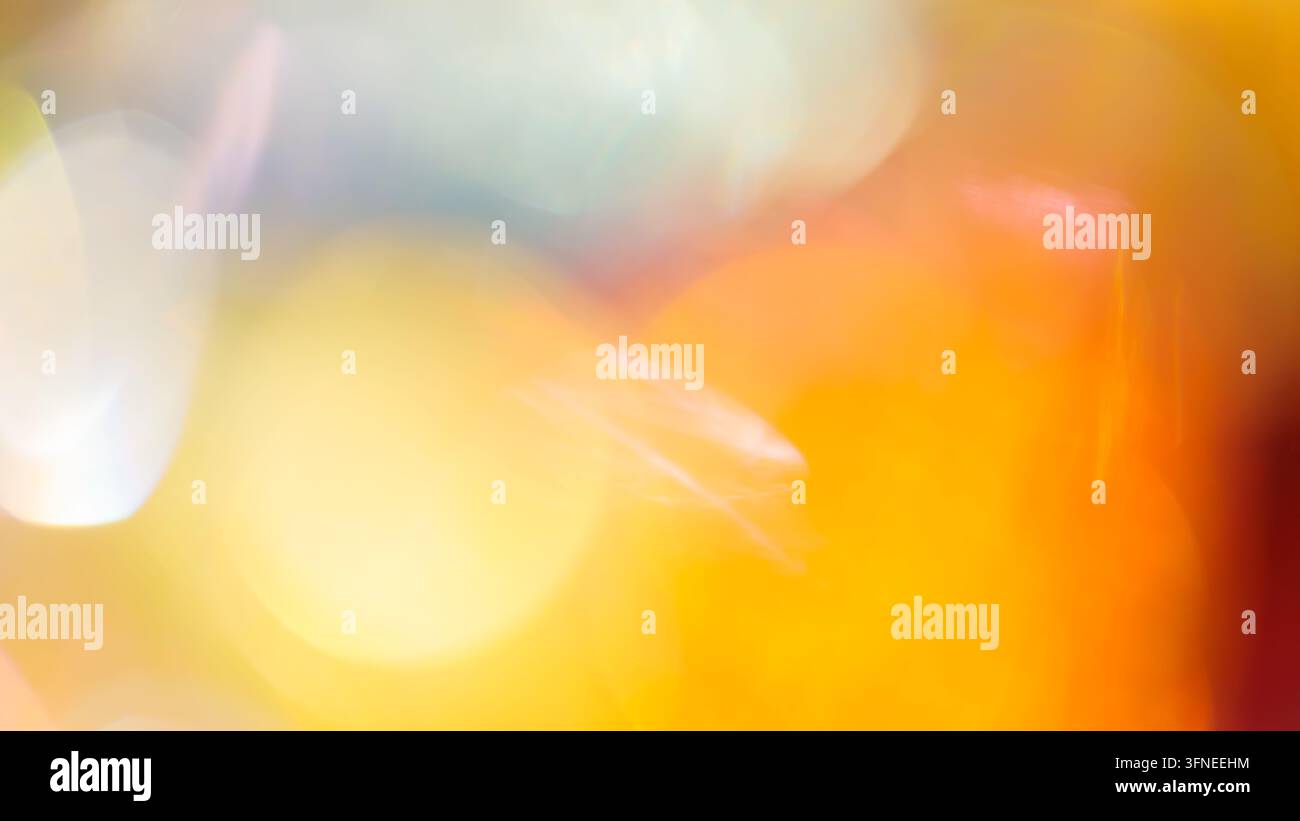 Blurred abstract background with soft orange bokeh and overlapping circular highlights Stock Photo
