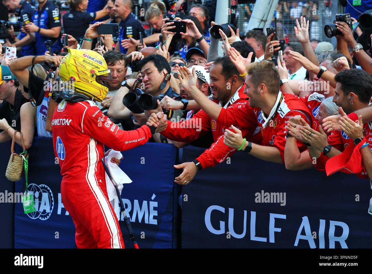 Lewis Hamilton (GBR) Scuderia Ferrari celebrates his third position ...