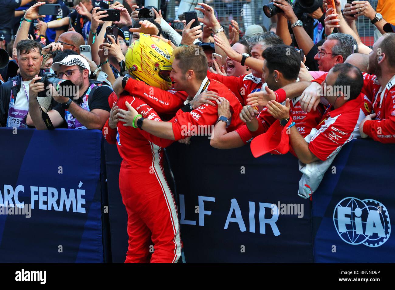 Lewis Hamilton (GBR) Scuderia Ferrari celebrates his third position ...