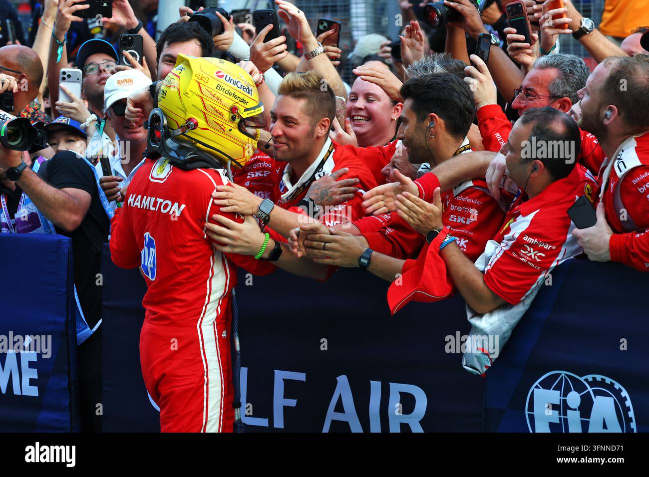 Lewis Hamilton (GBR) Scuderia Ferrari celebrates his third position ...