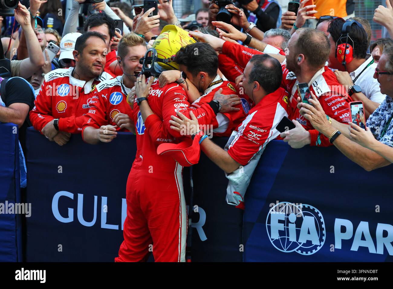 Lewis Hamilton (GBR) Scuderia Ferrari celebrates his third position ...