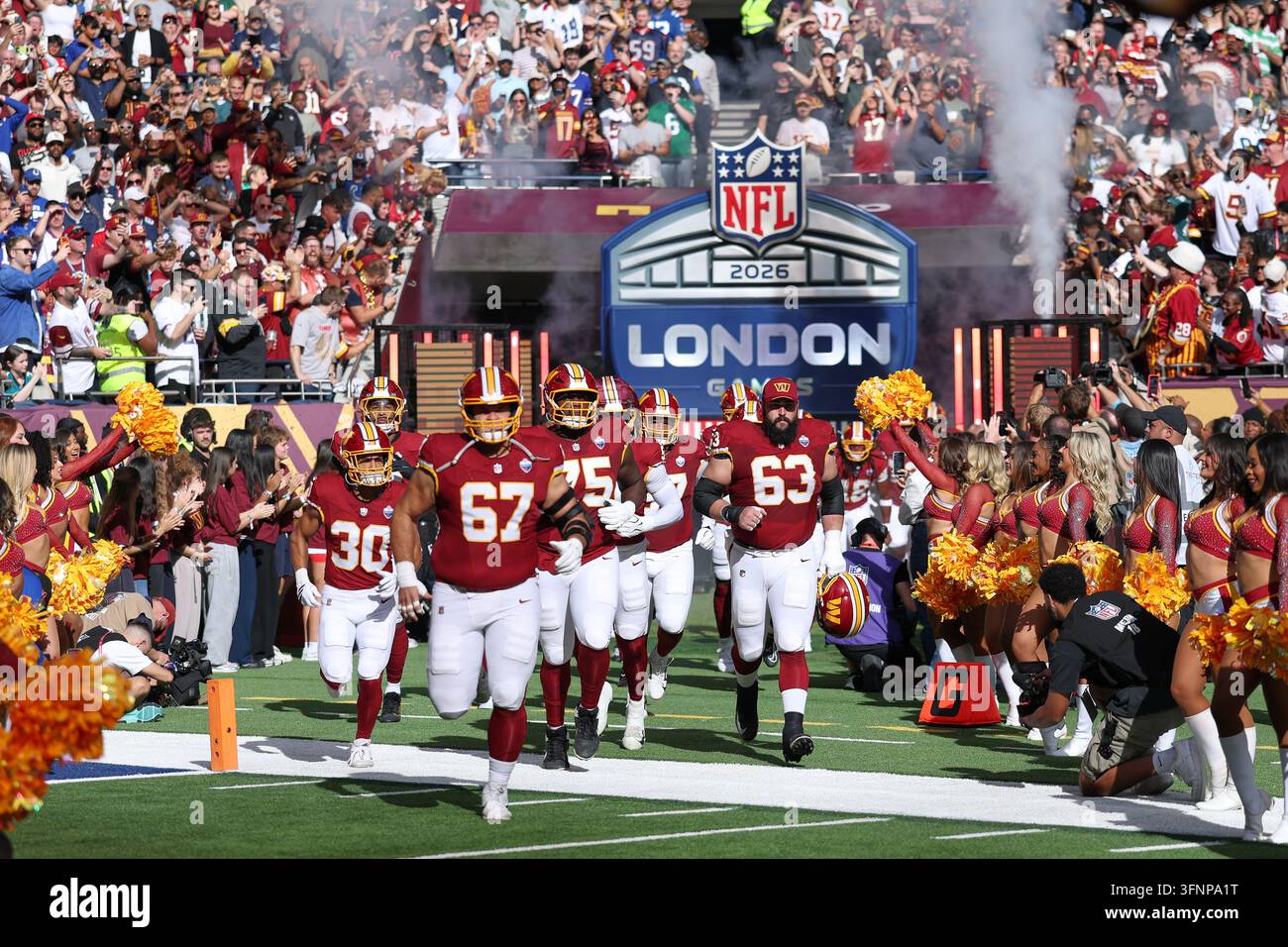 Commanders Vector Washington Commanders players run onto the field for an NFL football ...