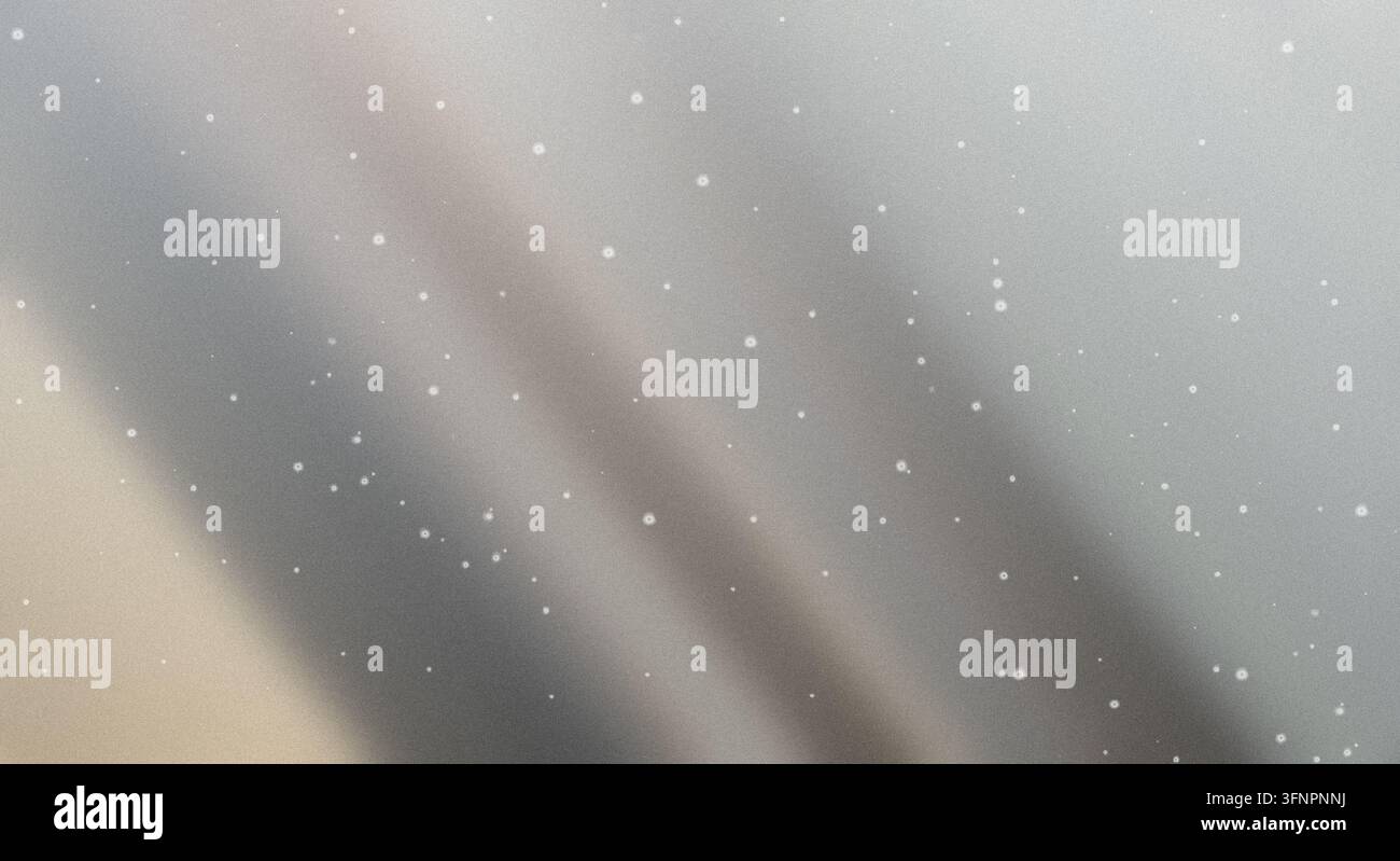 Abstract metallic silver gradient background with subtle wave patterns and glowing speckles creating a shimmering effect. Stock Photo