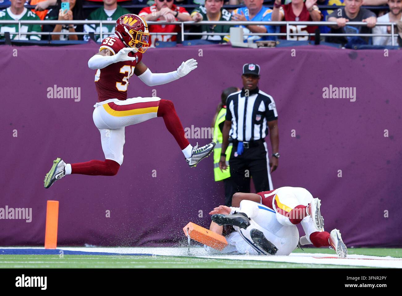 Washington Commanders safety Percy Butler (35) leaps over Indianapolis ...